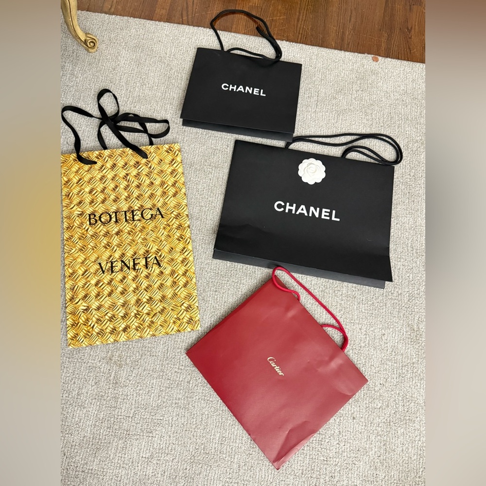 Four designer shopping empty bags